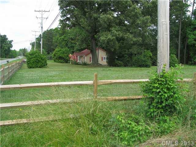 3320 Beaty Road Gastonia, NC 28056 - Photo 2 of 16 a green field with trees in the background