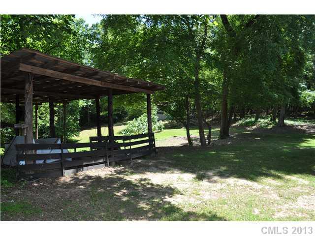 3320 Beaty Road Gastonia, NC 28056 - Photo 16 of 16 a view of a wooden bench sitting in the middle of a park