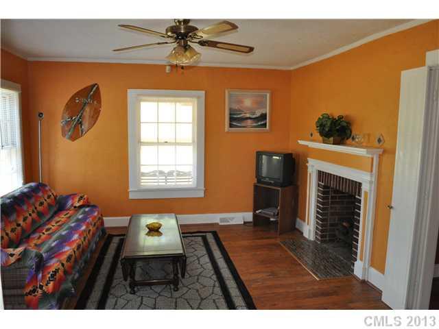 3320 Beaty Road Gastonia, NC 28056 - Photo 4 of 16 a living room with furniture and a fireplace