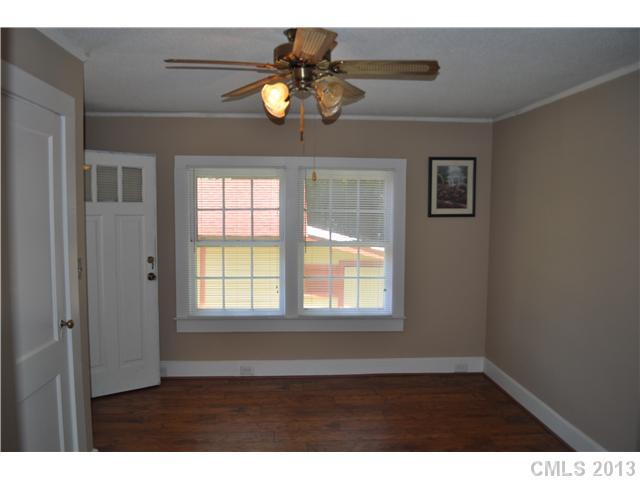 3320 Beaty Road Gastonia, NC 28056 - Photo 9 of 16 a view of an empty room with wooden floor and windows