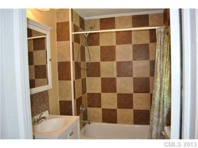 3320 Beaty Road Gastonia, NC 28056 - Photo 10 of 16 a bathroom with a shower and a sink