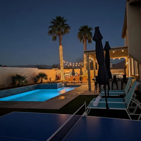 a kitchen with stainless steel appliances granite countertop a refrigerator a stove and a sink with wooden floor