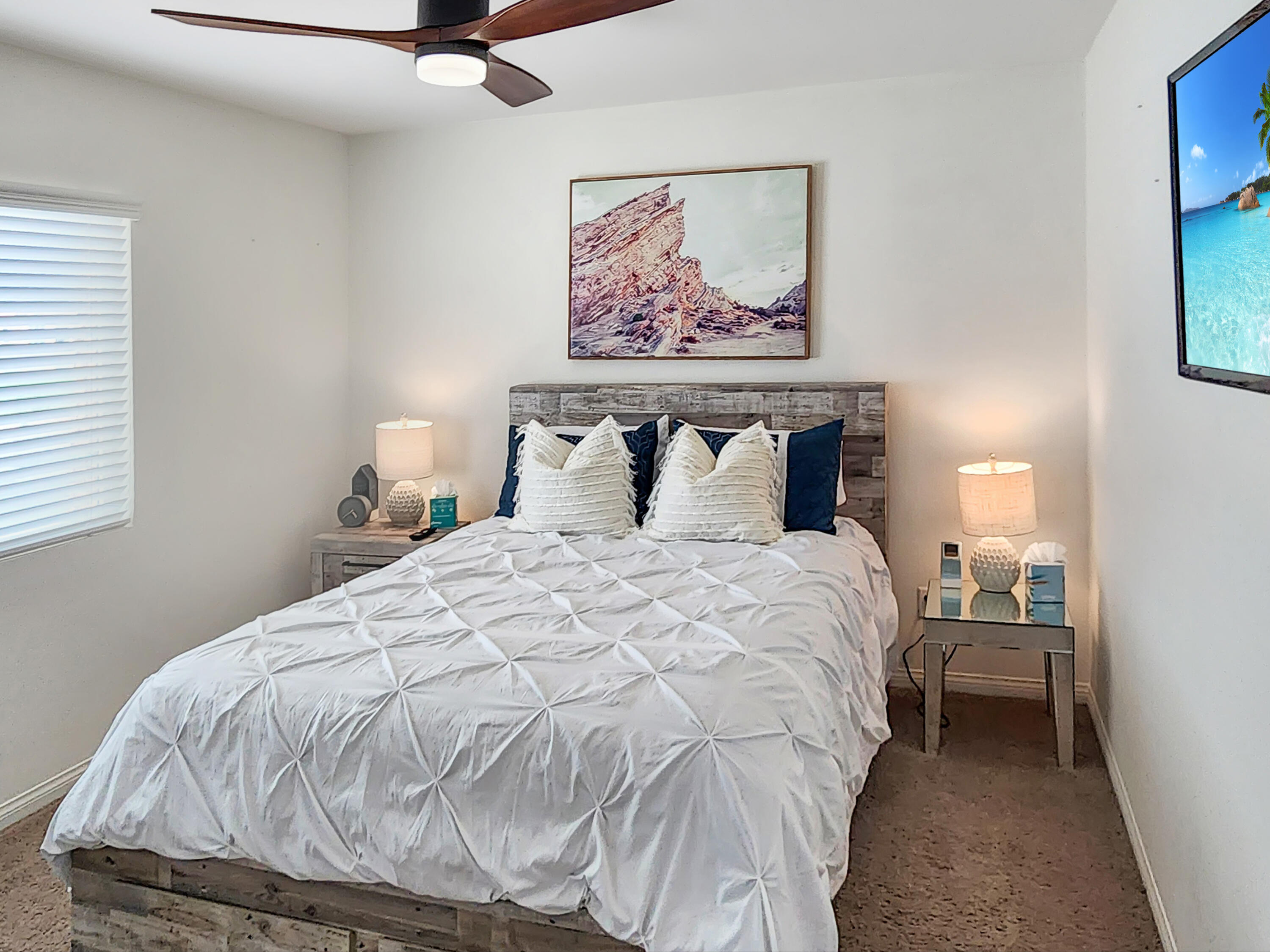 84450 Onda Drive Indio, CA 92203 - Photo 25 of 52 a bedroom with a bed and painting on the wall