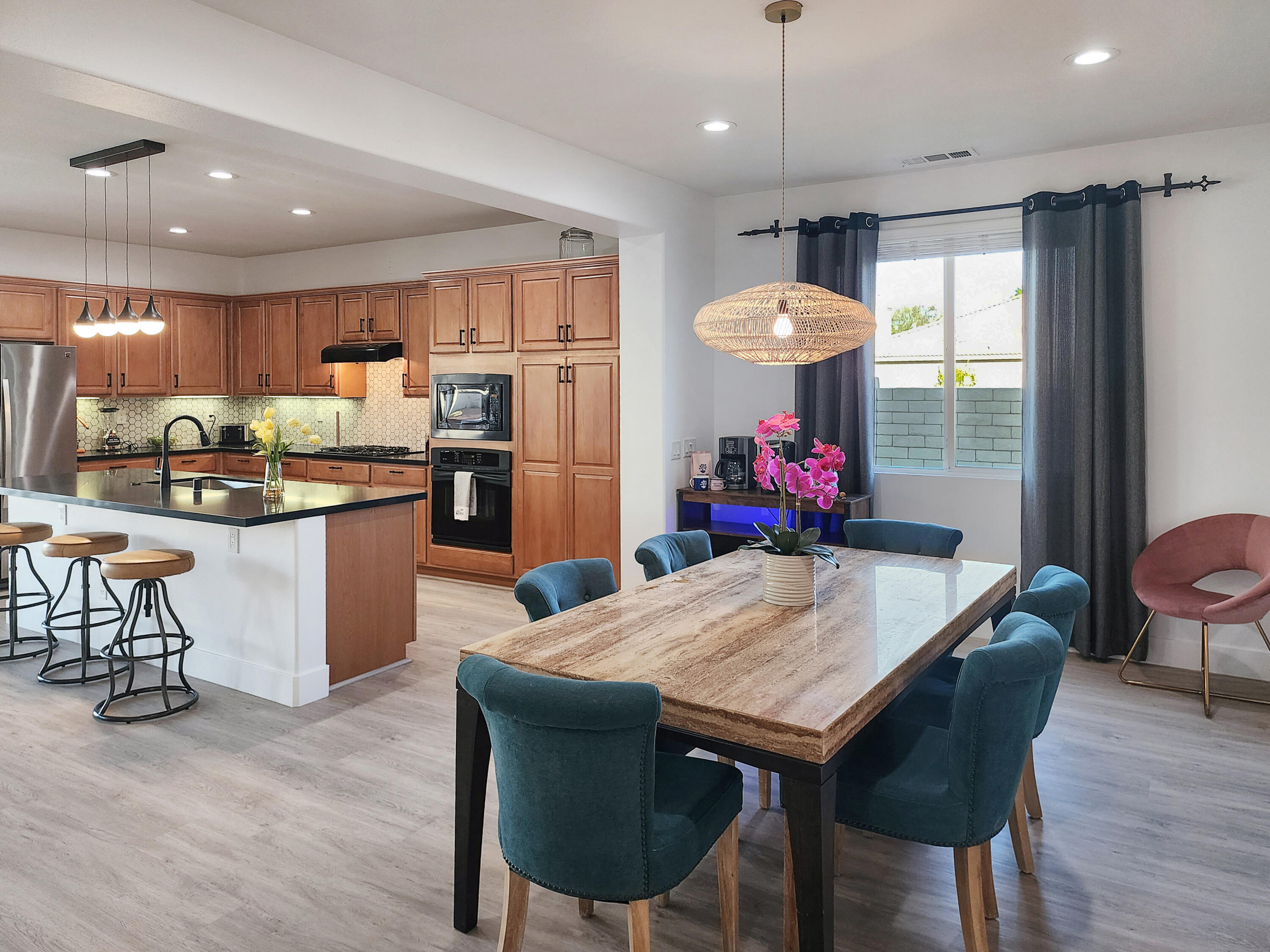 84450 Onda Drive Indio, CA 92203 - Photo 9 of 52 a view of a dining room with furniture window and wooden floor