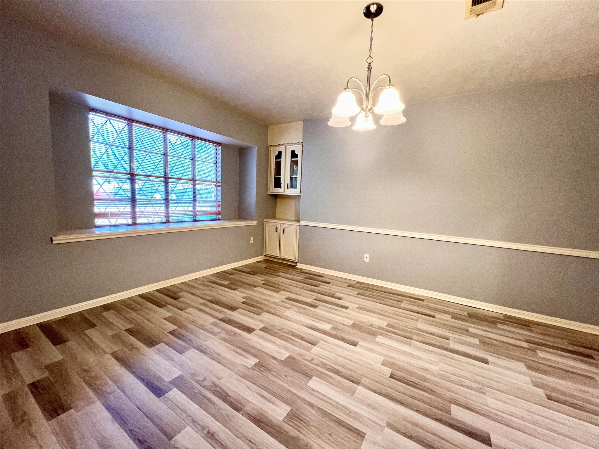 422 Gamewood Drive Spring, TX 77386 - Photo 15 of 26 a view of empty room with wooden floor and fan