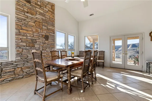 a kitchen with granite countertop a refrigerator and stove