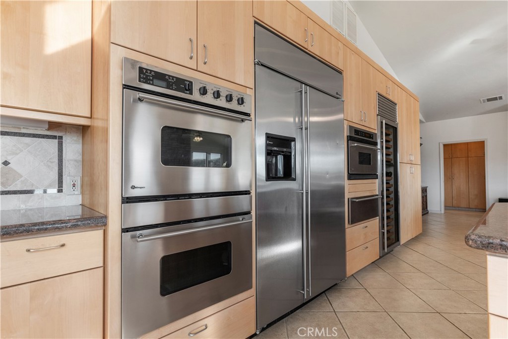 75751 Indian Valley Road San Miguel, CA 93451 - Photo 46 of 60 a kitchen with stainless steel appliances and granite countertop white cabinets a refrigerator with a sink