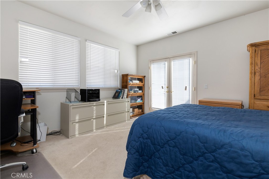 75751 Indian Valley Road San Miguel, CA 93451 - Photo 49 of 60 a bedroom with a bed and a flat tv screen