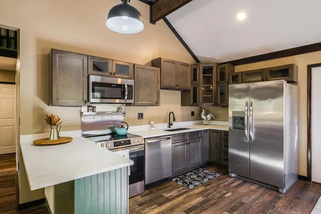 a view of a livingroom with furniture and a ceiling fan