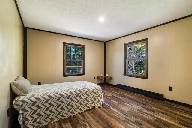 a view of balcony with wooden floor