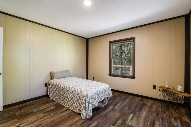 a room with a bed and furniture