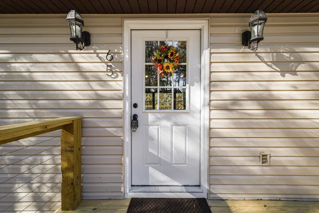 a kitchen with stainless steel appliances granite countertop a sink a stove a refrigerator and cabinets