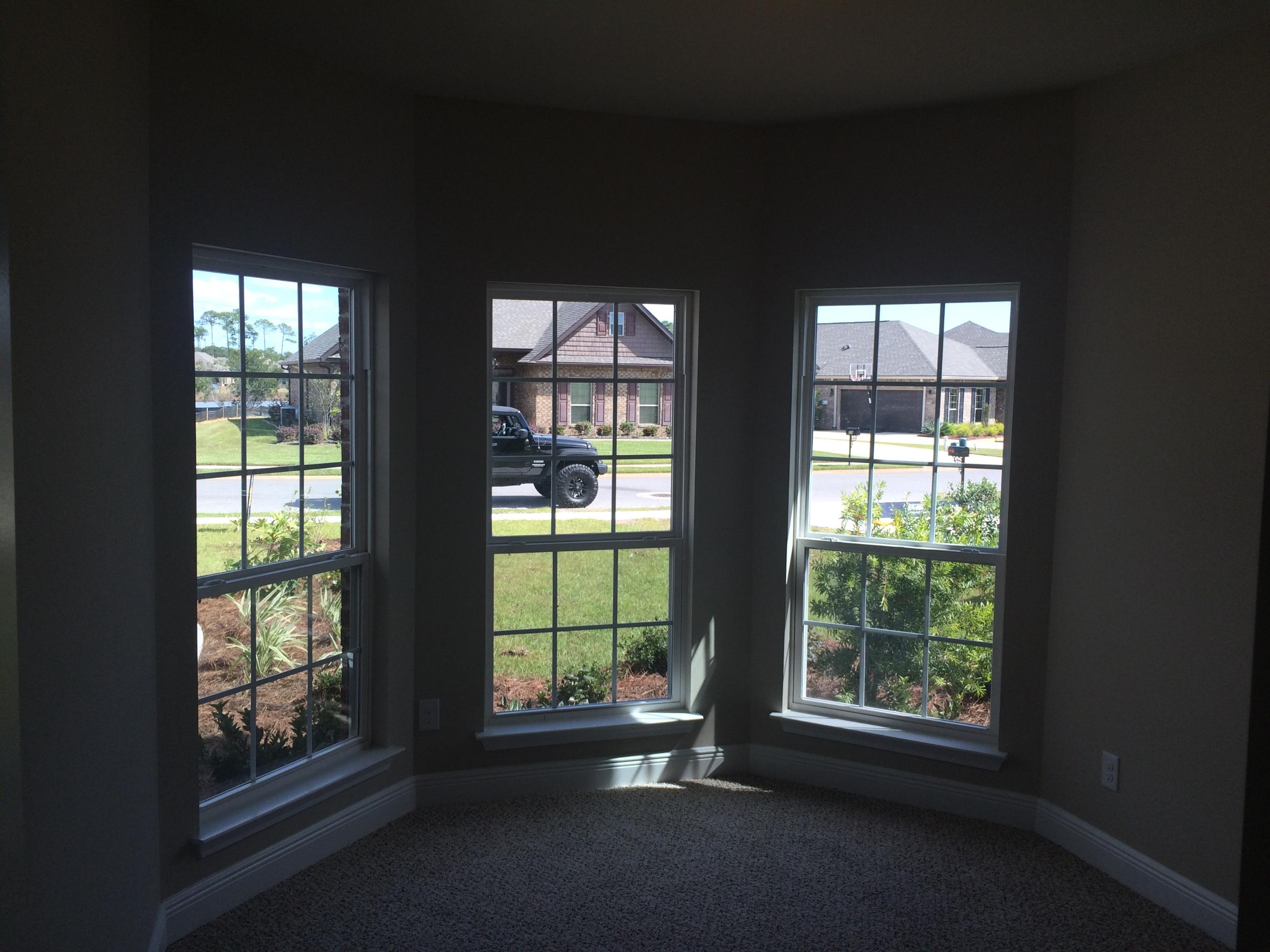 439 Pin Oak Loop Santa Rosa Beach, FL 32459 - Photo 7 of 17 a view of an empty room with a window