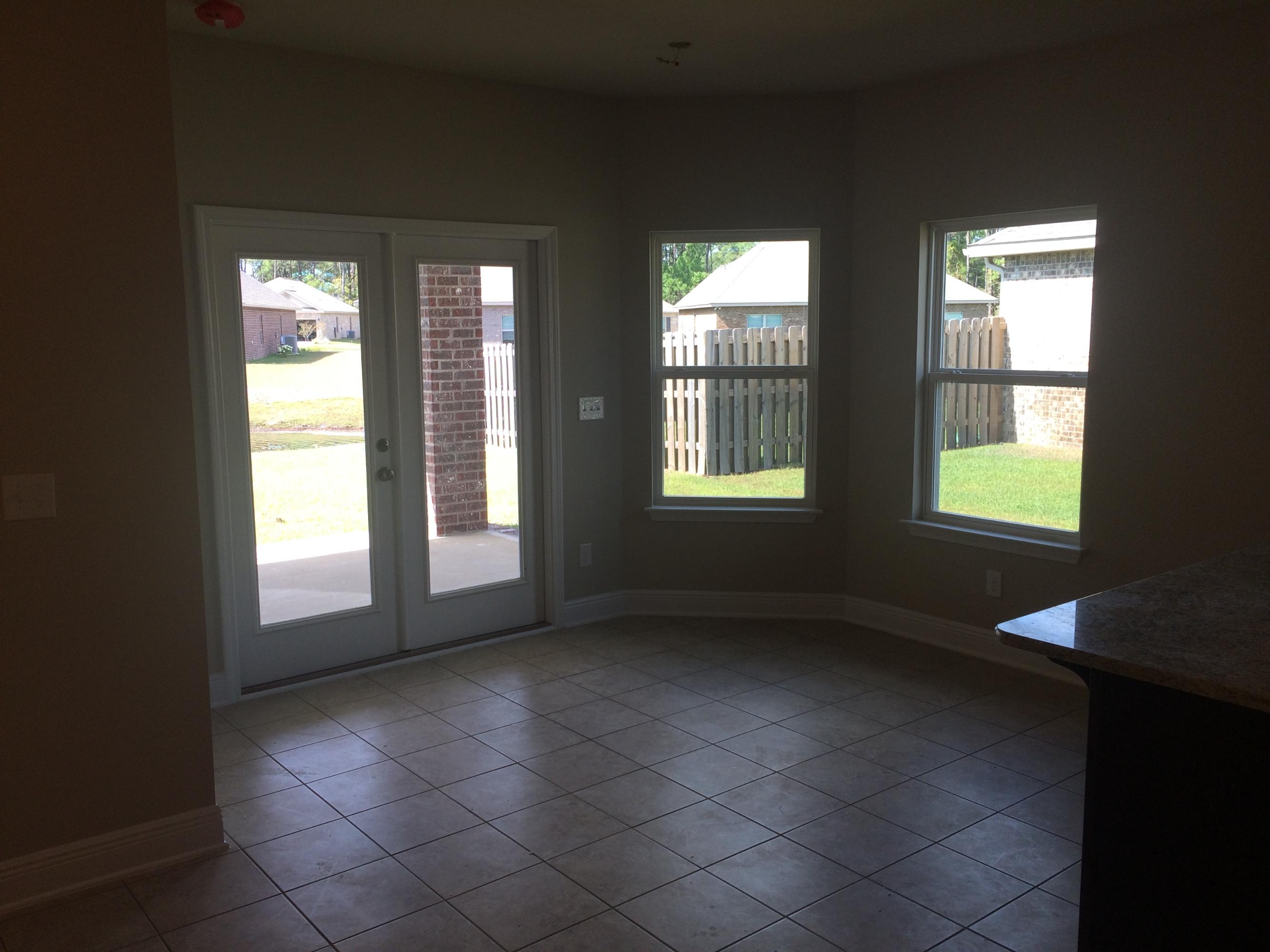 439 Pin Oak Loop Santa Rosa Beach, FL 32459 - Photo 10 of 17 a view of an empty room with a window