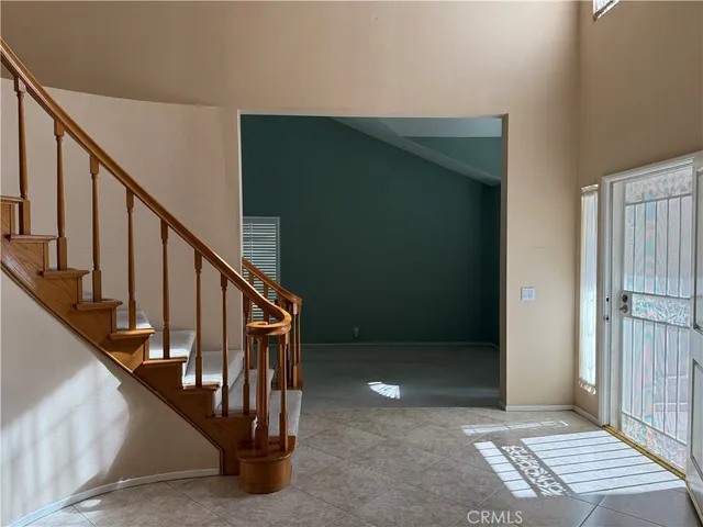 a view of staircase with white walls and stairs