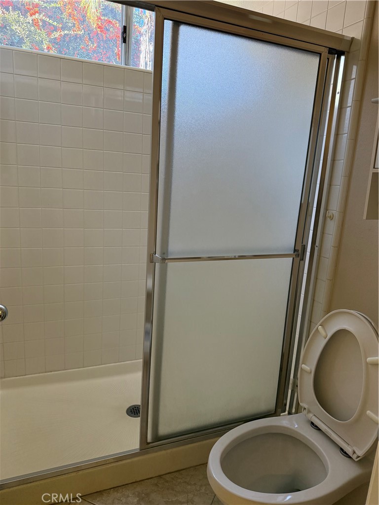 2000 Citrus Wood Lane Riverside, CA 92503 - Photo 20 of 51 a bathroom with a granite countertop toilet and a sink