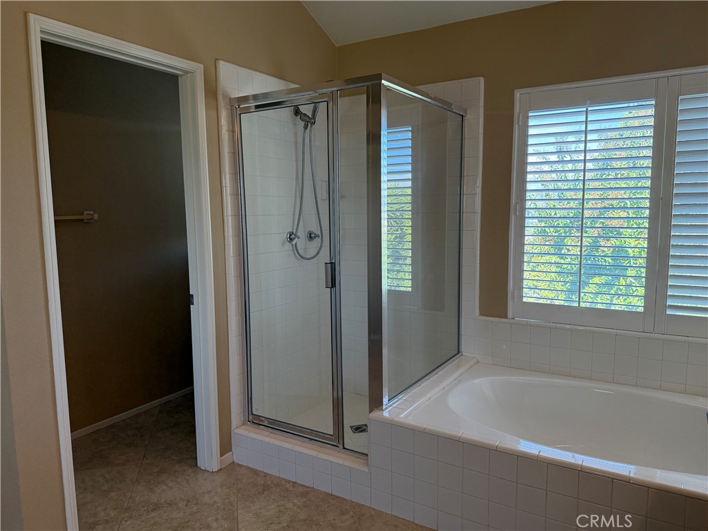 2000 Citrus Wood Lane Riverside, CA 92503 - Photo 27 of 51 a bathroom with a bathtub and a shower