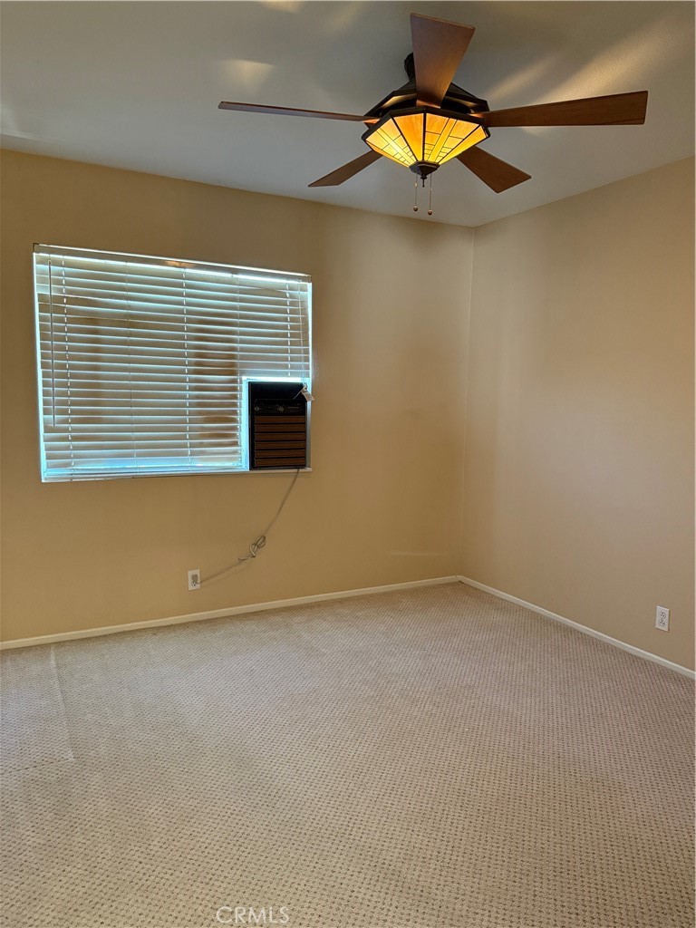 2000 Citrus Wood Lane Riverside, CA 92503 - Photo 30 of 51 an empty room with a window and potted plants