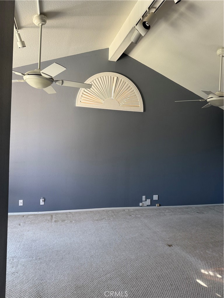 2000 Citrus Wood Lane Riverside, CA 92503 - Photo 34 of 51 an empty room with a chandelier fan and wooden floor