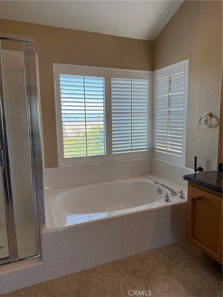 2000 Citrus Wood Lane Riverside, CA 92503 - Photo 37 of 51 a bathroom with a bathtub and a window