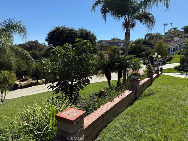 a view of a backyard with sitting area