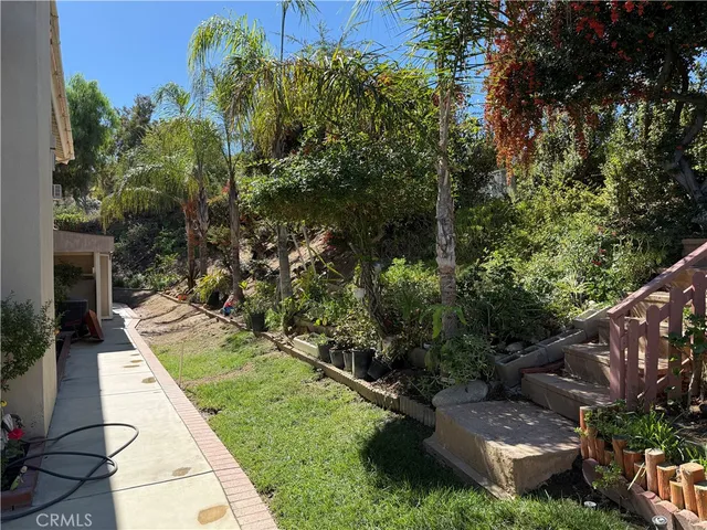 a close view of a brick wall with wooden floor