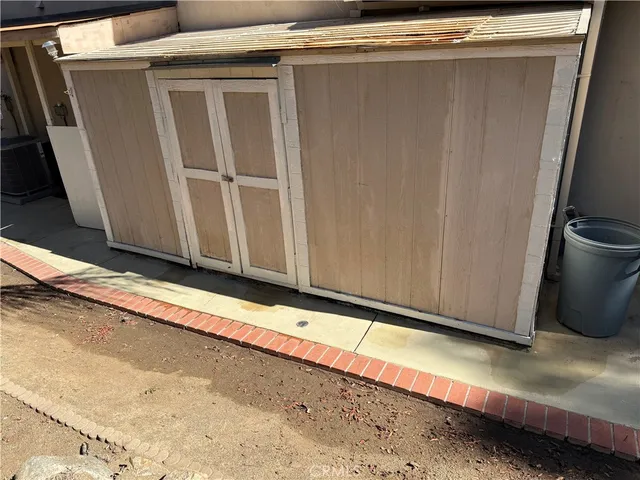 a view of a tree in the backyard