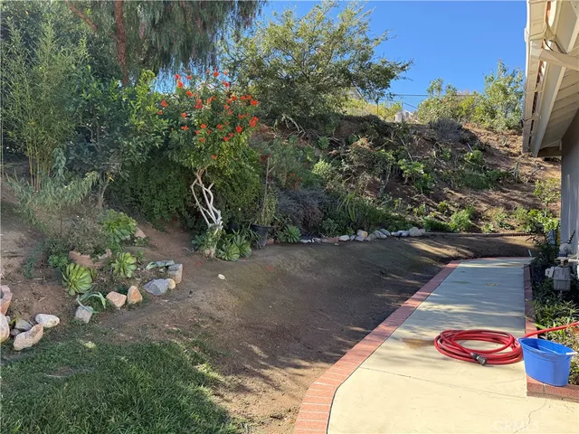 a view of a backyard of a house