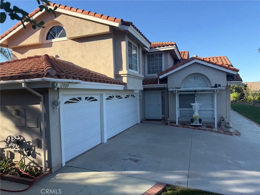 2000 Citrus Wood Lane Riverside, CA 92503 - Photo 50 of 51 a view of a house with a garage and barbeque grill