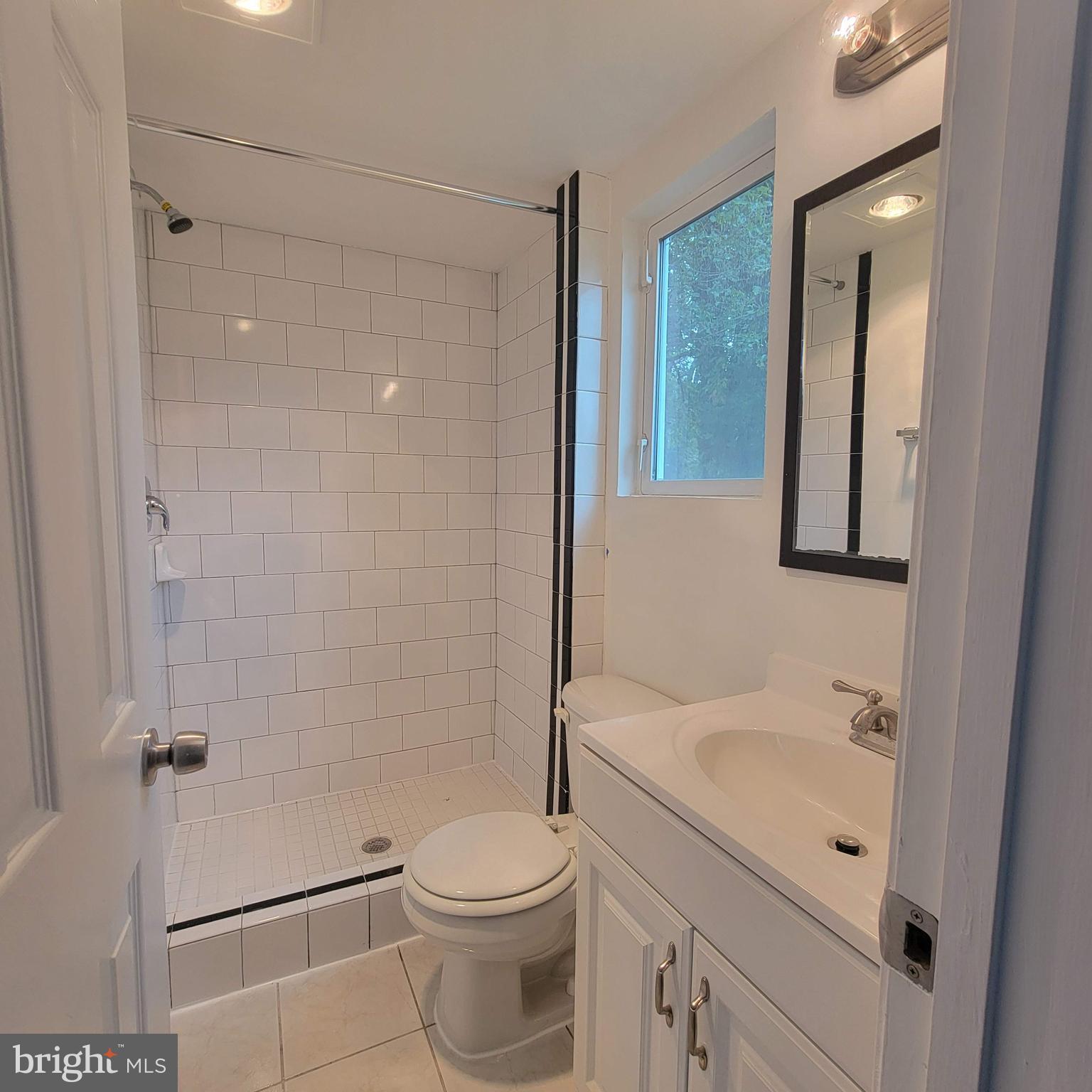 13300 Williams Drive Brandywine, MD 20613 - Photo 13 of 17 a bathroom with a sink a toilet and shower