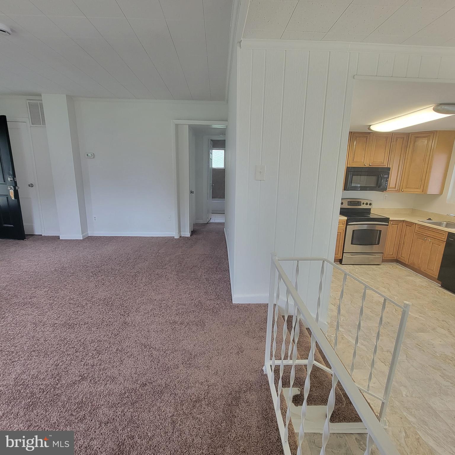 13300 Williams Drive Brandywine, MD 20613 - Photo 4 of 17 a view of a kitchen with furniture and staircase