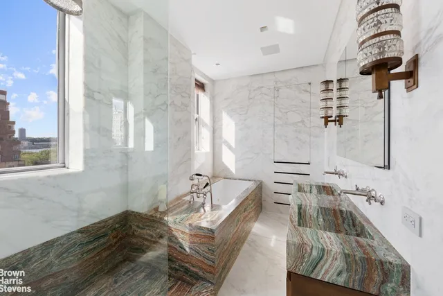 a bath room with a couch and a table