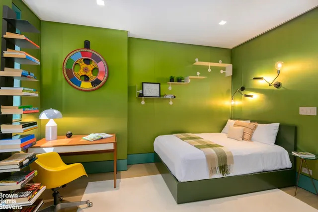 a bedroom with a bed and furniture