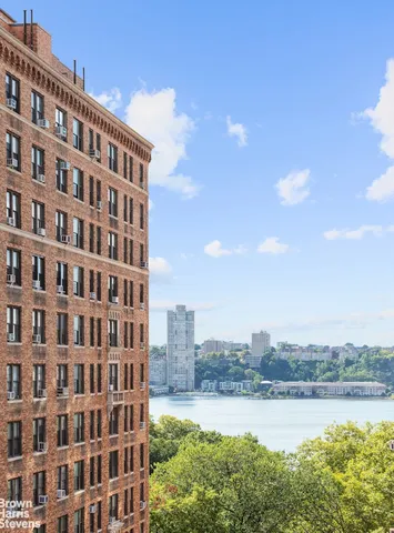 a view of a building with a lake