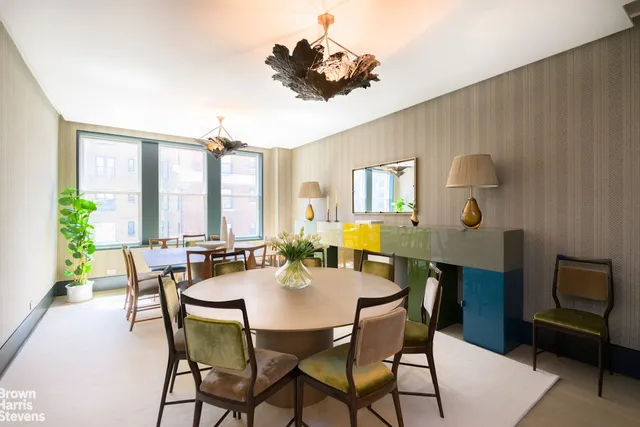 a dining room with furniture and window