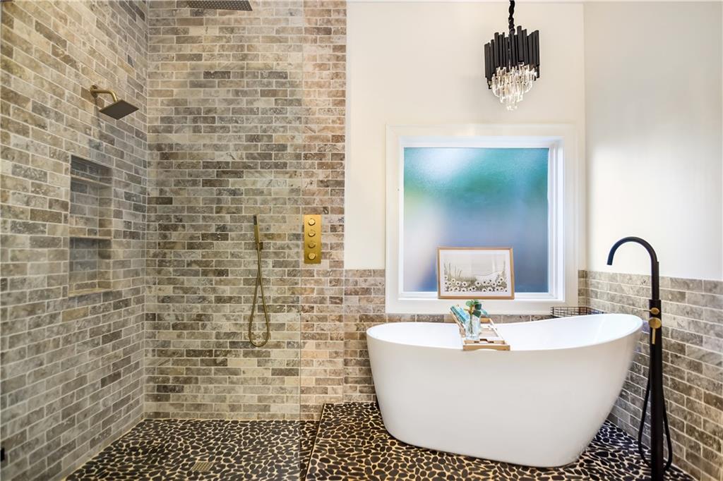 601 Legacy Run Ball Ground, GA 30107 - Photo 23 of 58 a white bath tub sitting in a bathroom