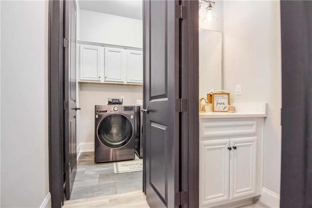 601 Legacy Run Ball Ground, GA 30107 - Photo 30 of 58 a utility room with sink dryer and washer