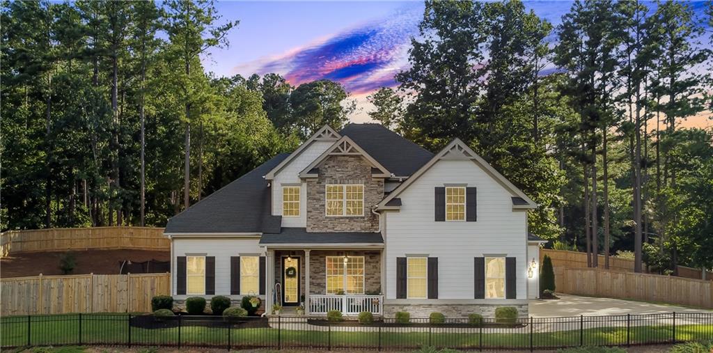 601 Legacy Run Ball Ground, GA 30107 - Photo 3 of 58 a front view of a house with a yard