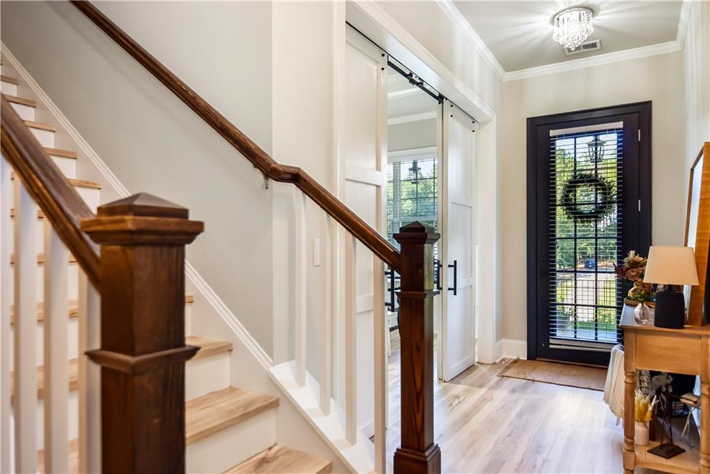 601 Legacy Run Ball Ground, GA 30107 - Photo 31 of 58 a view of entryway with wooden floor and stairs