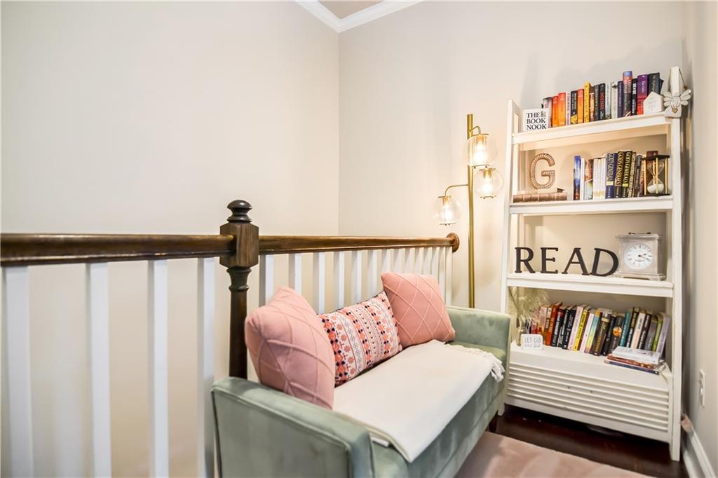 601 Legacy Run Ball Ground, GA 30107 - Photo 33 of 58 a living room with furniture and a book shelf