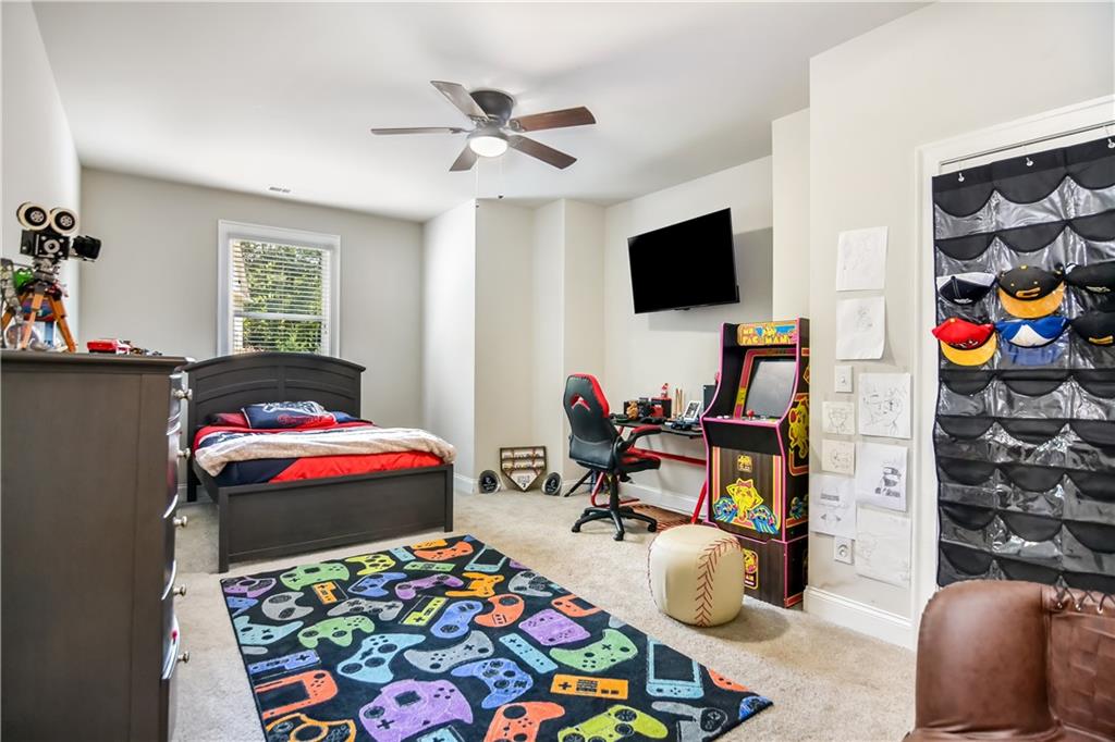 601 Legacy Run Ball Ground, GA 30107 - Photo 38 of 58 a living room with furniture and a flat screen tv