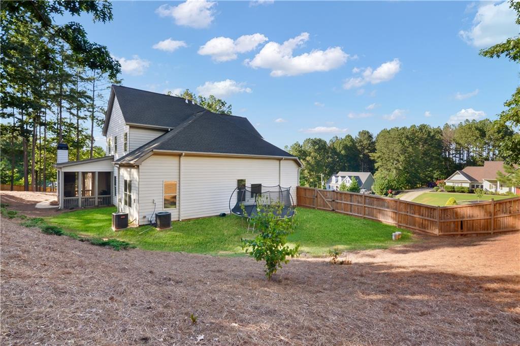 601 Legacy Run Ball Ground, GA 30107 - Photo 57 of 58 a front view of a house with a yard and garage