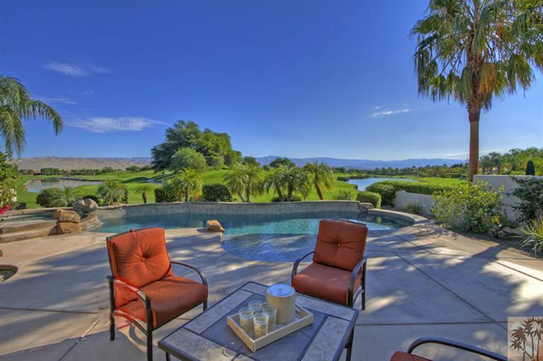 352 Loch Lomond Road Rancho Mirage, CA 92270 - Photo 1 of 25 a view of a chairs and table in patio with a yard