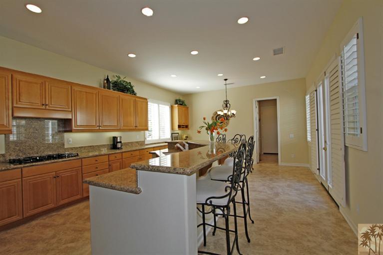 352 Loch Lomond Road Rancho Mirage, CA 92270 - Photo 11 of 25 a kitchen with granite countertop a sink and cabinets