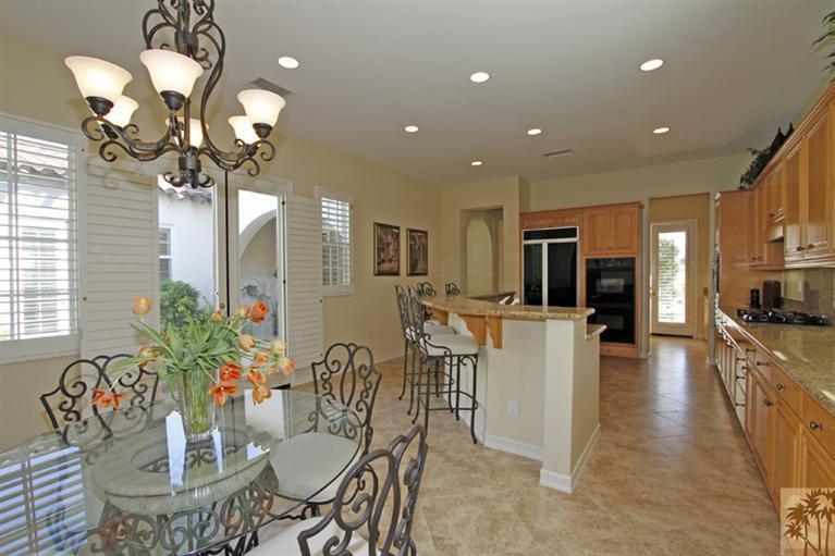 352 Loch Lomond Road Rancho Mirage, CA 92270 - Photo 14 of 25 a dining room filled counter top space and a chandelier