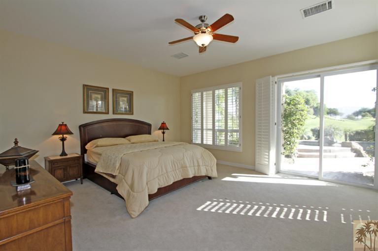 352 Loch Lomond Road Rancho Mirage, CA 92270 - Photo 15 of 25 a bedroom with a bed and a large window