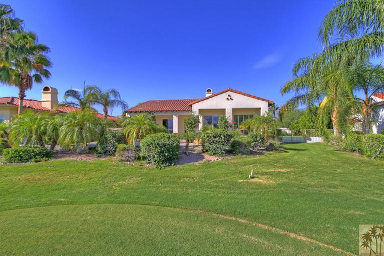 352 Loch Lomond Road Rancho Mirage, CA 92270 - Photo 20 of 25 a front view of a house with a yard