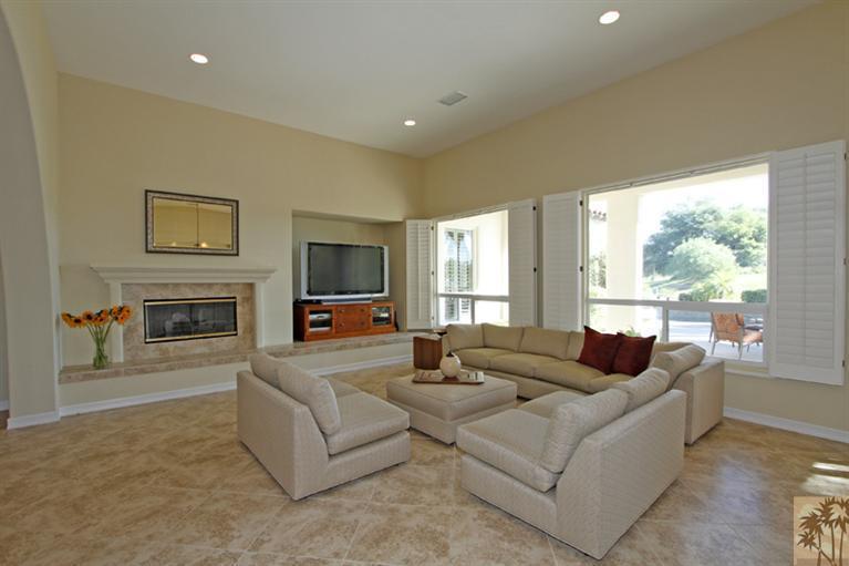 352 Loch Lomond Road Rancho Mirage, CA 92270 - Photo 7 of 25 a living room with fireplace furniture and a flat screen tv