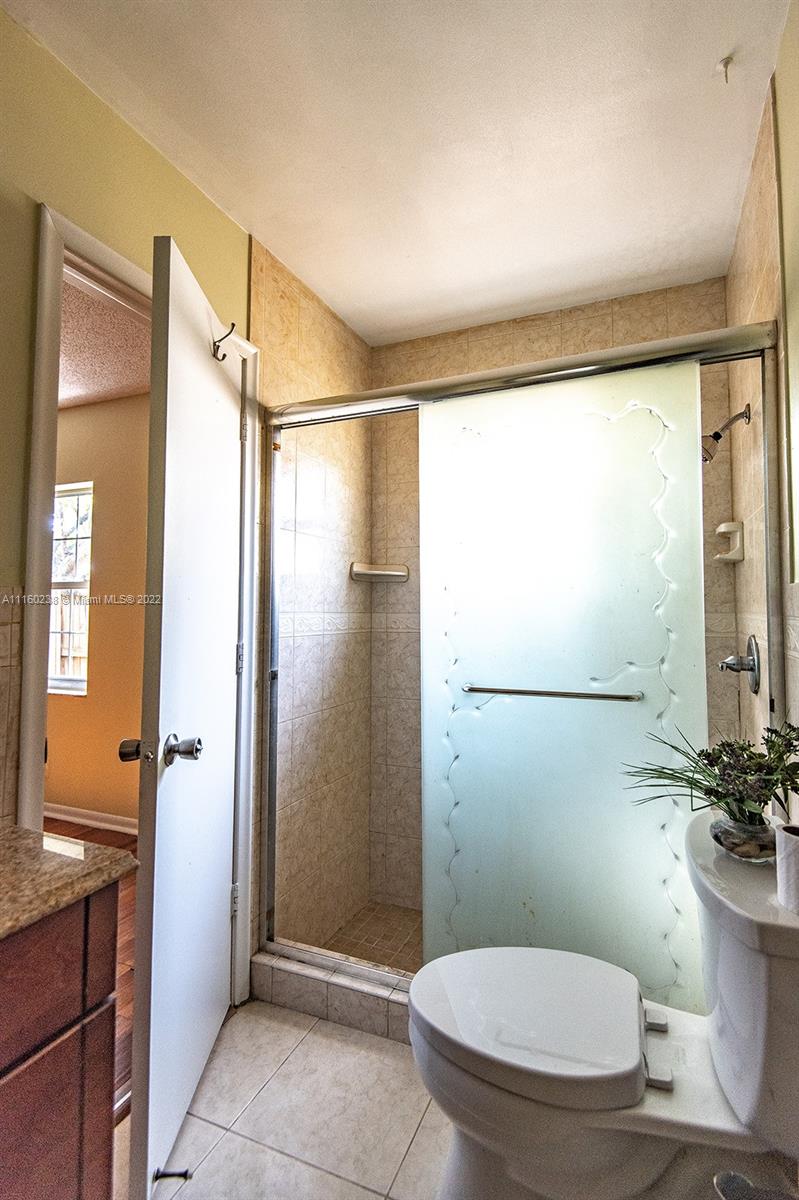 22788 Southwest 54th Way Boca Raton, FL 33433 - Photo 54 of 62 a bathroom with a sink toilet and shower
