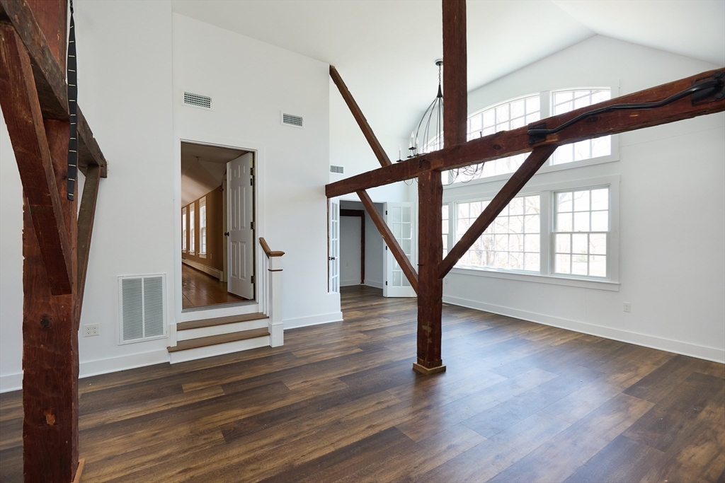 685 Highland Street Marshfield, MA 02050 - Photo 12 of 38 a view of an entryway with wooden floor and door